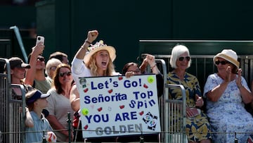 LONDON, ENGLAND - JULY 08: Mirra Andreeva holds a sign and shouts in support of her coach, Conchita Martinez of Spain as she plays during the Mixed Invitation Doubles round robin match with Greg Rusedeski of Great Britain against Katie O'Brien of Great Britain and Thomas Johansson of Sweden on day nine of The Championships Wimbledon 2025 at All England Lawn Tennis and Croquet Club on July 08, 2025 in London, England. (Photo by Julian Finney/Getty Images)