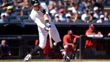 Aug 27, 2025; Bronx, New York, USA; New York Yankees designated hitter Aaron Judge (99) hits a single against the Washington Nationals during the third inning at Yankee Stadium. Mandatory Credit: Gregory Fisher-Imagn Images