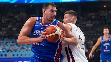 FIBA EuroBasket 2025 - Group Phase - Latvia v Serbia - Xiaomi Arena, Riga, Latvia - August 30, 2025 Serbia's Nikola Jokic in action with Latvia's Kristaps Porzingis.