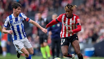 BILBAO, SPAIN - APRIL 16: Aritz Elustondo of Real Sociedad compete for the ball with Nico Williams of Athletic Club during the LaLiga Santander match between Athletic Club and Real Sociedad at San Mames Stadium on April 16, 2023 in Bilbao, Spain. (Photo by Ion Alcoba/Quality Sport Images/Getty Images)