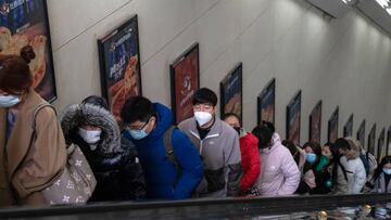Commuters ride an escalator at a subway station in Beijing, China, on Wednesday, Feb. 15, 2023. President Xi Jinping's push for a consumer-led economic recovery has hit a new barrier: Chinese citizens misusing cheap consumer loans. Source: Bloomberg
