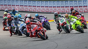 Ducati Lenovo Team's Spanish MotoGP rider Marc Marquez (C) leads the pack during the race of the MotoGP German motorcycle Grand Prix at the Sachsenring racing circuit, in Hohenstein-Ernstthal near Chemnitz, eastern Germany on July 13, 2025. (Photo by Ronny Hartmann / AFP)