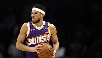 CHARLOTTE, NORTH CAROLINA - JANUARY 07: Devin Booker #1 of the Phoenix Suns brings the ball up court during the first half of game against the Charlotte Hornets at Spectrum Center on January 07, 2025 in Charlotte, North Carolina. NOTE TO USER: User expressly acknowledges and agrees that, by downloading and or using this photograph, User is consenting to the terms and conditions of the Getty Images License Agreement. (Photo by Jared C. Tilton/Getty Images)