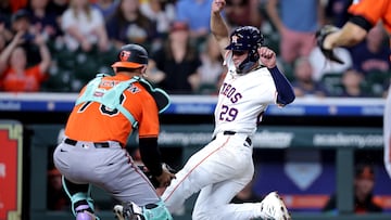 Aug 16, 2025; Houston, Texas, USA; Baltimore Orioles catcher Alex Jackson (70) tags out Houston Astros second baseman Ramon Urias (29) at home plate during the 11th inning at Daikin Park. Mandatory Credit: Erik Williams-Imagn Images