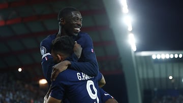 Soccer Football - UEFA Super Cup - Final - Paris St Germain v Tottenham Hotspur - Bluenergy Stadium, Udine, Italy - August 13, 2025 Paris Saint Germain's Goncalo Ramos celebrates scoring their second goal with Ousmane Dembele REUTERS/Guglielmo Mangiapane