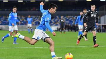 Napoli's Mexican forward Hirving Lozano shoots and scores a goal kicks the ball during the Italian Serie A football match between SSC Napoli and Empoli FC at the Diego Armando Maradona Stadium in Naples on December 12, 2021. (Photo by Tiziana FABI /