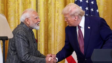 FILE PHOTO: U.S. President Donald Trump and Indian Prime Minister Narendra Modi shake hands as they attend a joint press conference at the White House in Washington, D.C., U.S., February 13, 2025. REUTERS/Kevin Lamarque/File Photo