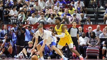 Cooper Flagg #32 of the Dallas Mavericks is guarded by Bronny James #9 of the Los Angeles Lakers in the first half of a 2025 NBA Summer League game at the Thomas & Mack Center on July 10, 2025 in Las Vegas, Nevada.