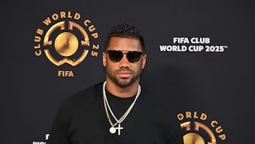 US football player Russell Wilson poses on the Golden Carpet upon arrival for the FIFA Club World Cup 2025 final football match between England's Chelsea and France's Paris Saint-Germain at the MetLife Stadium in East Rutherford, New Jersey on July 13, 2025. (Photo by ANGELA WEISS / AFP)
