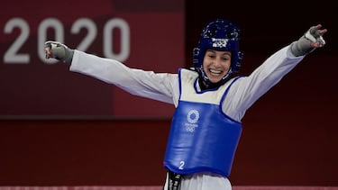 Spain's Adriana Cerezo Iglesias (Blue) celebrates after winning the taekwondo women's -49kg semi-final bout against Turkey's Rukiye Yildirim (Red) compete in during the Tokyo 2020 Olympic Games at the Makuhari Messe Hall in Tokyo on July 24, 2021. (Photo