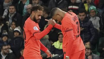 PSG's Kylian Mbappe, right, and PSG's Neymar celebrate after scoring their side's second goal during the French League One soccer match between Saint-Etienne and Paris Saint-Germain, at the Geoffroy Guichard stadium, in Saint-Etienne, centr