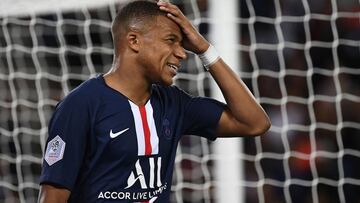 Paris Saint-Germain's French forward Kylian Mbappe reacts during the French L1 football match between Paris Saint-Germain (PSG) and Nimes Olympique on August 11, 2019 at the Parc des Princes stadium in Paris. (Photo by FRANCK FIFE / AFP)
