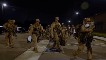U.S. Marines carry their packs, as protests against federal immigration sweeps continue, in greater Los Angeles, California, U.S., June 9, 2025, in this screen grab taken from a handout video. U.S. Marine Corps/Handout via REUTERS THIS IMAGE HAS BEEN SUPPLIED BY A THIRD PARTY