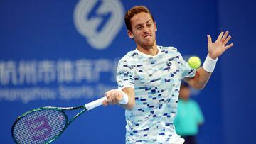 Spain's Roberto Carballes Baena hits a return against China's Zhang Zhizhen during their men's singles quarterfinal match at the ATP Hangzhou Open tennis tournament in Hangzhou, in eastern China's Zhejiang province on September 22, 2024. (Photo by AFP) / China OUT