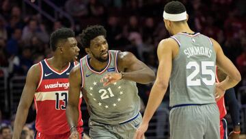 Nov 30, 2018; Philadelphia, PA, USA; Philadelphia 76ers center Joel Embiid (21) celebrates with guard Ben Simmons (25) in front or Washington Wizards center Thomas Bryant (13) after a three pointer during the first quarter at Wells Fargo Center. Mandatory Credit: Bill Streicher-USA TODAY Sports
