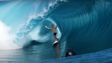 Eimeo Czermak en Teahupo'o abriendo los brazos en una ola gigante en forma de tubo.