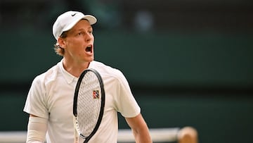 Italy's Jannik Sinner reacts as he plays against Spain's Carlos Alcaraz during their men's singles final tennis match on the fourteenth day of the 2025 Wimbledon Championships at The All England Lawn Tennis and Croquet Club in Wimbledon, southwest London, on July 13, 2025. (Photo by Kirill KUDRYAVTSEV / AFP) / RESTRICTED TO EDITORIAL USE