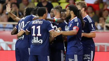 Lyon's French forward Moussa Dembele celebrates (3R) after scoring a goal during the French L1 football match between AS Monaco (ASM) and Olympique Lyonnais (OL) at the Stade Louis II stadium in Monaco on August 9, 2019. (Photo by VALERY HACHE / AFP)