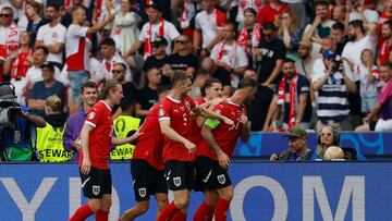 Austria's players celebrate scoring their third goal during the UEFA Euro 2024 Group D football match between Poland and Austria at the Olympiastadion in Berlin on June 21, 2024. (Photo by AXEL HEIMKEN / AFP)