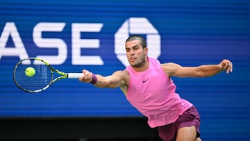 Spain's Carlos Alcaraz plays a forehand return to France�s Arthur Rinderknech during their men's singles round of 16 tennis match on day eight of the US Open tennis tournament at the USTA Billie Jean King National Tennis Center in New York City, on August 31, 2025. (Photo by ANGELA WEISS / AFP)