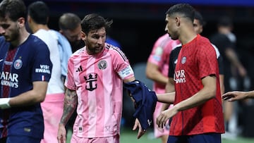 Inter Miami's Argentine forward #10 Lionel Messi (CL) and Paris Saint-Germain's Moroccan defender #02 Achraf Hakimi (CR) exchange shirts at the end of the FIFA Club World Cup 2025 round of 16 football match between France's Paris Saint-Germain and US Inter Miami at the Mercedes-Benz Stadium in Atlanta on June 29, 2025. (Photo by FRANCK FIFE / AFP)