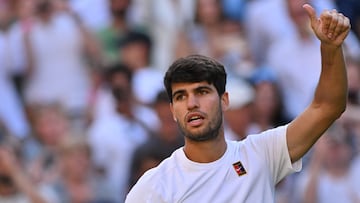 Spain's Carlos Alcaraz celebrates after winning against Britain's Cameron Norrie during their men's singles quarter-final tennis match on the ninth day of the 2025 Wimbledon Championships at The All England Lawn Tennis and Croquet Club in Wimbledon, southwest London, on July 8, 2025. (Photo by Glyn KIRK / AFP) / RESTRICTED TO EDITORIAL USE