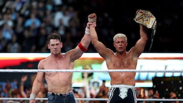 EAST RUTHERFORD, NEW JERSEY - AUGUST 03: John Cena congratulates Cody Rhodes after Rhodes won and became the WWE Undisputed Champion during the WWE 2025 SummerSlam at MetLife Stadium on August 03, 2025 in East Rutherford, New Jersey. Elsa/Getty Images/AFP (Photo by ELSA / GETTY IMAGES NORTH AMERICA / Getty Images via AFP)