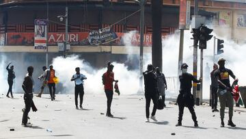 Demonstrators gesture as police use tear gas to disperse protesters during a demonstration against Kenya's proposed finance bill 2024/2025 in Nairobi, Kenya, June 25, 2024. REUTERS/Monicah Mwangi
