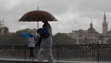 SEVILLE ANDALUSIA, SPAIN - SEPTEMBER 13: Two people walk under their umbrellas on the day that the Community of Andalusia has been put on yellow warning for storms and rain. On September 13, 2022, in Seville (Andalusia, Spain). The State Meteorological Agency (Aemet) has activated for this Tuesday, from the early morning, yellow alert for the possibility of heavy rainfall in the provinces of Cordoba, Huelva, Jaen and Seville. Specifically, from 00.00 hours in the early hours of Tuesday weighs yellow alert for heavy rainfall of up to 15 milliliters of water per hour in all areas of the provinces of Cordoba, Huelva and Seville. (Photo By Maria Jose Lopez/Europa Press via Getty Images)