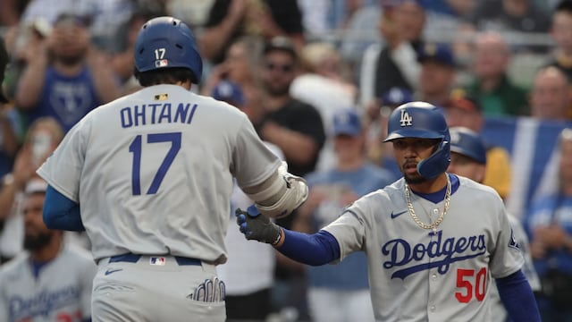 Sep 2, 2025; Pittsburgh, Pennsylvania, USA; Los Angeles Dodgers shortstop Mookie Betts (50) greets two-way player Shohei Ohtani (17) crossing home plate on a solo home run against the Pittsburgh Pirates during the third inning at PNC Park. Mandatory Credit: Charles LeClaire-Imagn Images
