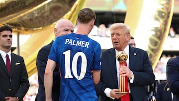 U.S. President Donald Trump presents Chelsea's Cole Palmer with the golden ball trophy next to FIFA president Gianni Infantino after Chelsea won against Paris St Germain in the FIFA Club World Cup final, at the MetLife Stadium in East Rutherford, New Jersey, U.S., July 13, 2025. REUTERS/Kevin Lamarque/Pool