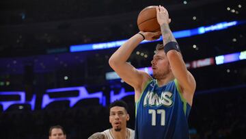 December 1, 2019; Los Angeles, CA, USA; Dallas Mavericks forward Luka Doncic (77) shoots a three point basket in front of Los Angeles Lakers guard Danny Green (14) during the first half at Staples Center. Mandatory Credit: Gary A. Vasquez-USA TODAY Sports