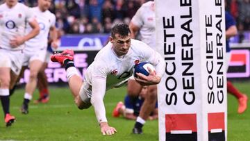 (FILES) In this file photo taken on February 2, 2020 England's wing Jonny May dives across the line to score a try during the Six Nations rugby union tournament match between France and England at the stade de France, in Saint Denis, on the outskirts of Paris. - Covid-19 delayed the finish of the 2020 edition and has cast a shadow over this season's tournament because of health fears regarding cross-border travel. But England are set to begin their scheduled title defence at home to arch-rivals Scotland on February 6. (Photo by FRANCK FIFE / AFP) / XGTY
