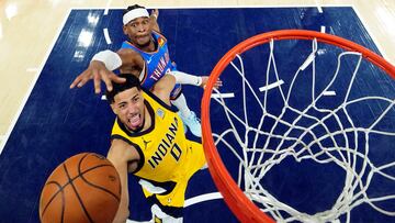 Jun 13, 2025; Indianapolis, Indiana, USA; Indiana Pacers guard Tyrese Haliburton (0) shoots the ball against Oklahoma City Thunder guard Shai Gilgeous-Alexander (2) during the second half during game four of the 2025 NBA Finals at Gainbridge Fieldhouse. Mandatory Credit: Kyle Terada-Imagn Images TPX IMAGES OF THE DAY