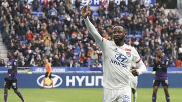 Lyon's Moussa Dembele celebrates after scoring his side's second goal during the French League One soccer match between Lyon and Toulouse in Decines, outside Lyon, central France, Sunday, Jan. 26, 2020. (AP Photo/Laurent Cipriani)