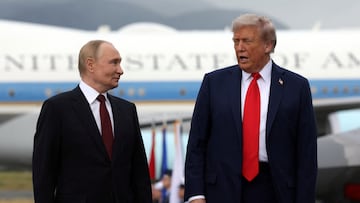 Russian President Vladimir Putin and U.S. President Donald Trump pose on a podium on the tarmac after they arrived to attend a meeting at Joint Base Elmendorf-Richardson in Anchorage, Alaska, U.S., August 15, 2025. Sputnik/Gavriil Grigorov/Pool via REUTERS ATTENTION EDITORS - THIS IMAGE WAS PROVIDED BY A THIRD PARTY.