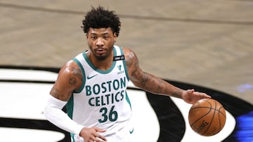 (FILES) In this file photo taken on April 23, 2021, Marcus Smart of the Boston Celtics dribbles during the first half against the Brooklyn Nets at Barclays Center in the Brooklyn borough of New York City. NOTE TO USER: User expressly acknowledges and agrees that, by downloading and or using this photograph, User is consenting to the terms and conditions of the Getty Images License Agreement. Sarah Stier/Getty Images/AFP - Smart was suspended one game without pay by the NBA on April 28, 2021, for using threatening language to a referee in a April 27 loss to Oklahoma City. (Photo by Sarah Stier / GETTY IMAGES NORTH AMERICA / AFP)