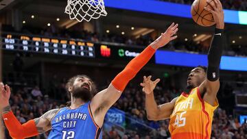 Mar 11, 2019; Salt Lake City, UT, USA; Utah Jazz guard Donovan Mitchell (45) shoots the ball over Oklahoma City Thunder center Steven Adams (12) during the fourth quarter at Vivint Smart Home Arena. Oklahoma City won 114-104. Mandatory Credit: Chris Nicoll-USA TODAY Sports