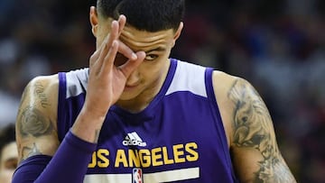 LAS VEGAS, NV - JULY 15: Kyle Kuzma #0 of the Los Angeles Lakers reacts after hitting a 3-pointer late in the team's 2017 Summer League game againt the Brooklyn Nets at the Thomas & Mack Center on July 15, 2017 in Las Vegas, Nevada. Los Angeles won 115-106. NOTE TO USER: User expressly acknowledges and agrees that, by downloading and or using this photograph, User is consenting to the terms and conditions of the Getty Images License Agreement. Ethan Miller/Getty Images/AFP == FOR NEWSPAPERS, INTERNET, TELCOS & TELEVISION USE ONLY ==