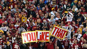 LANDOVER, MD - JANUARY 10: Fans hold signs in the first quarter during the NFC Wild Card Playoff game between the Green Bay Packers and the Washington Redskins at FedExField on January 10, 2016 in Landover, Maryland. Elsa/Getty Images/AFP
== FOR NEWSPAPERS, INTERNET, TELCOS & TELEVISION USE ONLY ==