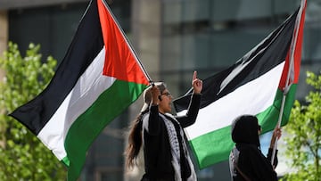 Protesters wave Palestinian flags as students and workers hold a pro-Palestinian rally outside MIT's Stata Center, demanding MIT divest from Israel, among other demands, in Cambridge, Massachusetts, U.S. May 9, 2024. REUTERS/Nicholas Pfosi