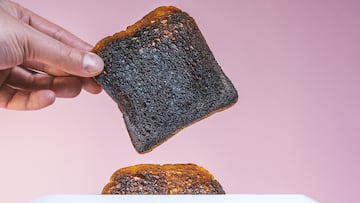Pieces of bread pop-up from breadtoaster. burnt bread
