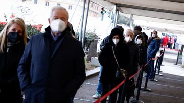 People wait to get a dose of the vaccine against the coronavirus disease (COVID-19), on the day Italy brings in tougher rules for the unvaccinated, at a Red Cross vaccination centre by Termini main train station in Rome, Italy, January 10, 2022. REUTERS/Guglielmo Mangiapane