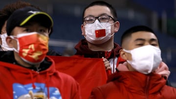 Soccer Football - World Cup - Asian Qualifiers - Group B - Japan v China - Saitama Stadium, Saitama, Japan - January 27, 2022 China fans wear protective face masks inside the stadium before the match REUTERS/Issei Kato