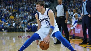 OAKLAND, CA - MARCH 23: Luka Doncic #77 of the Dallas Mavericks dribbles the ball against the Golden State Warriors during an NBA basketball game at ORACLE Arena on March 23, 2019 in Oakland, California. NOTE TO USER: User expressly acknowledges and agrees that, by downloading and or using this photograph, User is consenting to the terms and conditions of the Getty Images License Agreement. (Photo by Thearon W. Henderson/Getty Images)
