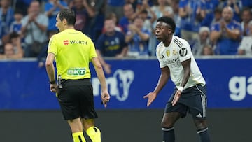 Real Madrid's Brazilian forward #07 Vinicius Junior reacts after receiving a yellow card during the Spanish league football match between Real Oviedo and Real Madrid CF at Carlos Tartiere Stadium in Oviedo on August 24, 2025. (Photo by Cesar MANSO / AFP)