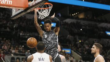 Mar 21, 2018; San Antonio, TX, USA; San Antonio Spurs point guard Dejounte Murray (5) dunks the ball during the first half against the Washington Wizards at AT&T Center. Mandatory Credit: Soobum Im-USA TODAY Sports