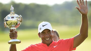 Jhonattan Vegas celebrates his win of the final round of the 2017 Canadian Open with the winner's trophy at the Glen Abbey Golf Club in Oakville, Ontario, on Sunday, July 30, 2017. (Nathan Denette/The Canadian Press via AP)