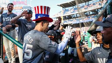 WASHINGTON, DC - JUNE 15: Joey Meneses #45 of the Washington Nationals celebrates with teammates while wearing the Uncle Sam home run top hat after hitting a home run against the Miami Marlins during the eighth inning at Nationals Park on June 15, 2024 in Washington, DC. Scott Taetsch/Getty Images/AFP (Photo by Scott Taetsch / GETTY IMAGES NORTH AMERICA / Getty Images via AFP)