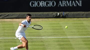 Serbia's Novak Djokovic returns the ball to Canada's Felix Auger-Aliassime during their men's exhibition singles match at The Giorgio Armani Tennis Classic tournament at the Hurlingham Club, in London, on June 22, 2022. (Photo by Adrian DENNIS / AFP)